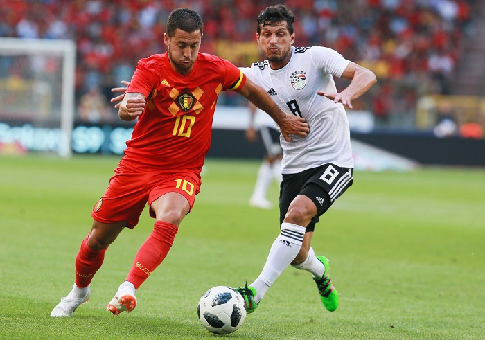 Eden Hazard of Belgium and Kahbaba of Egypt fight for the ball.