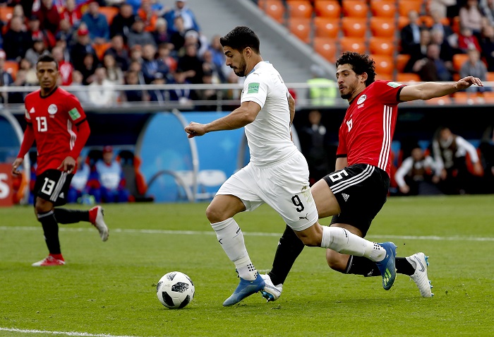 Luis Suarez of Uruguay and Ahmed Hegazy of Egypt.