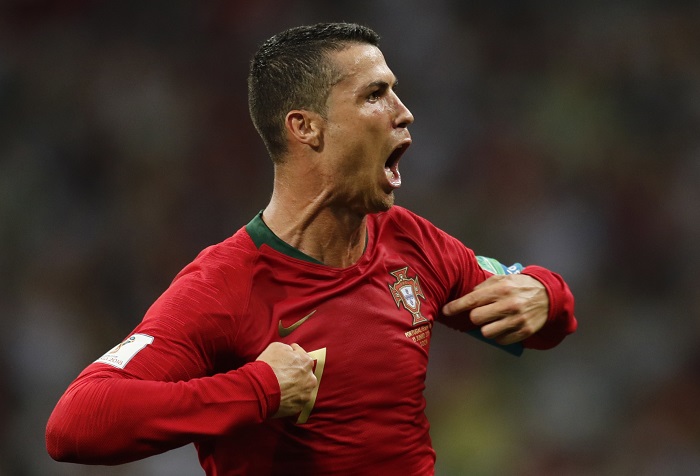 Cristiano Ronaldo of Portugal celebrates after scoring his third goal in the World Cup game against Spain.