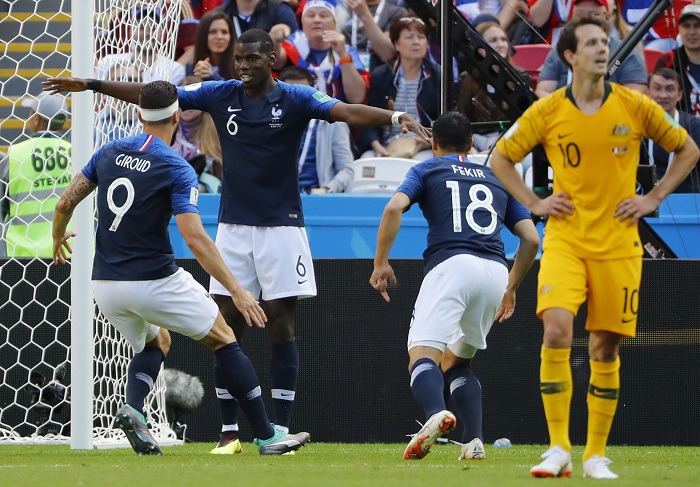 Paul Pogba of France celebrates with team mate after scoring the winner against Australia.