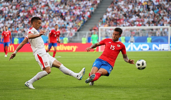 Dusan Tadic of Serbia in action against Francisco Calvo of Costa Rica.