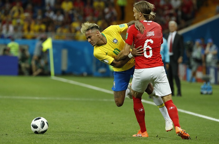 Neymar of Brazil and Michael Lang of Switzerland.