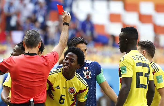 Carlos Sanchez of Colombia receives a red card just three minutes into his opening World Cup game.