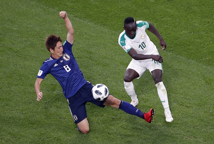 Sadio Mane of Senegal and Genki Haraguchi of Japan