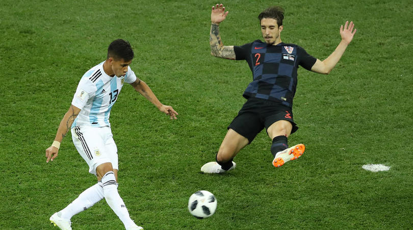 Maximiliano Meza of Argentina passes the ball past Sime Vrsaljko of Croatia.