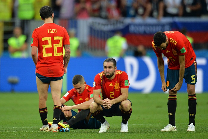 Players of Spain react after losing to Russia on penalties.