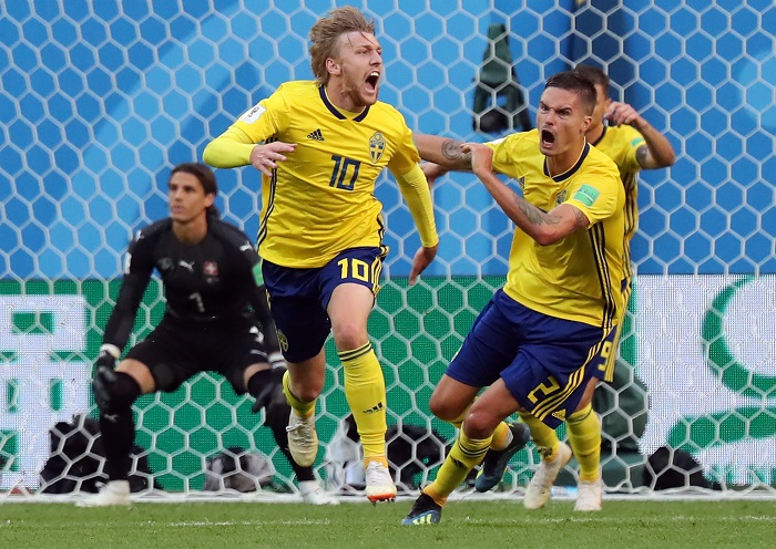 Emil Forsberg of Sweden reacts with Mikael Lustig of Sweden celebrate taking the lead.