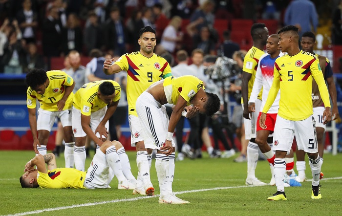 Players of Colombia react after the penalty shootout loss to England.