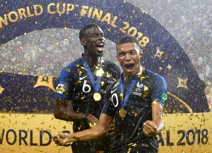 Paul Pogba and Kylian Mbappe of France celebrate winning the World Cup.