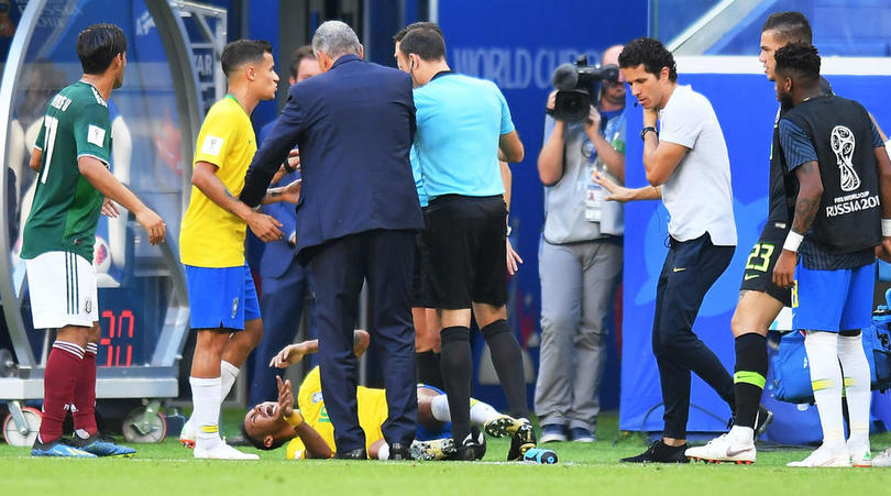 Neymar receiving treatment against Mexico.