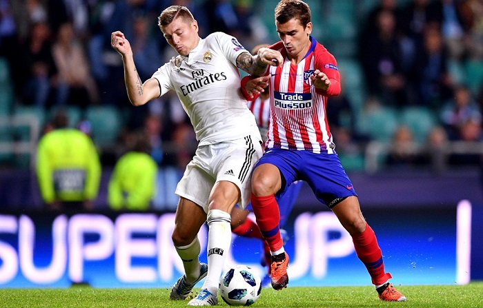 Antoine Griezmann of Atletico Madrid and Toni Kroos of Real Madrid.