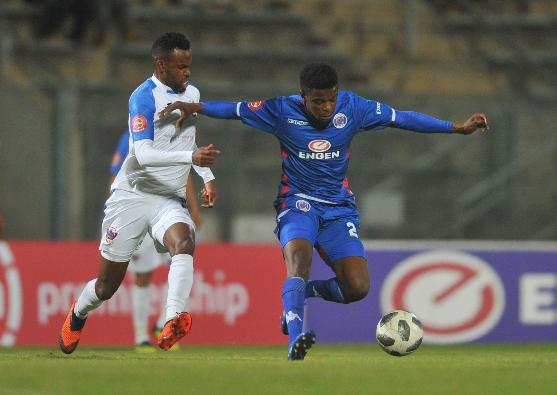 Teboho Mokoena is challenged by Jabulani Shongwe