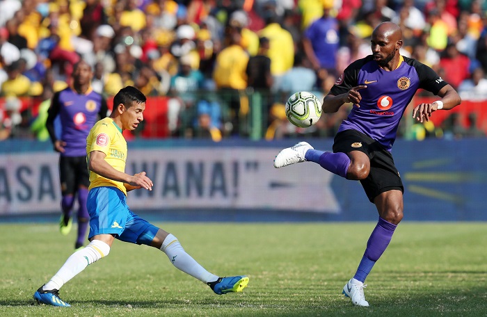 Ramahlwe Mphahlele of Kaizer Chiefs challenged by Gaston Sirino of Mamelodi Sundowns