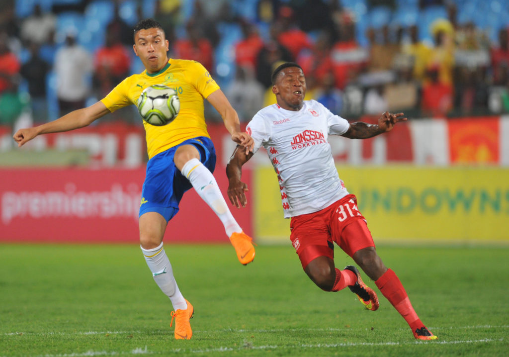 Ricardo Nascimento is challenged by Sabelo Nyembe