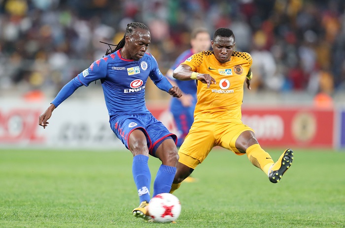 Reneilwe Letsholonyane challenged by George Maluleka