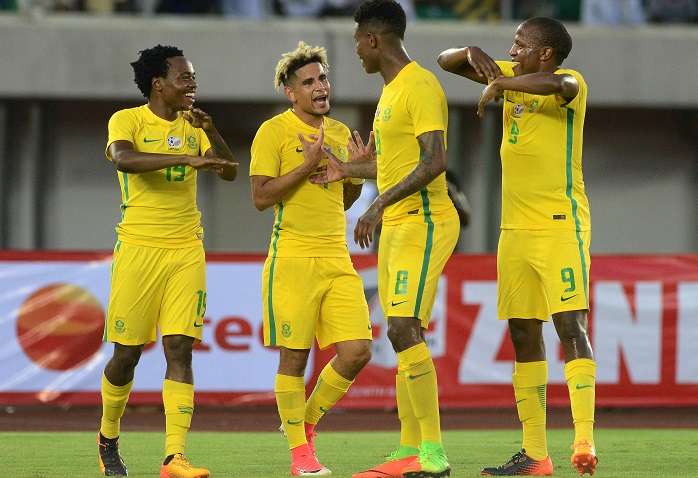 Percy Tau of Bafana Bafana with teammates Keagan Dolly, Bongani Zungu