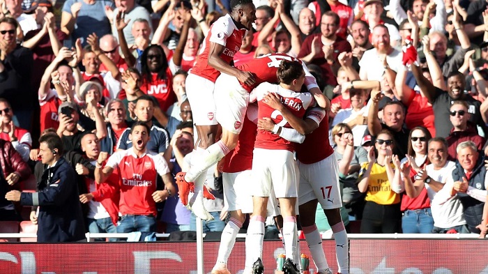 Mesut Ozil of Arsenal celebrates scoring their second goal.