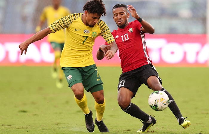 Hamdou Elhouni of Libya challenged by Keagan Dolly of Bafana Bafana.