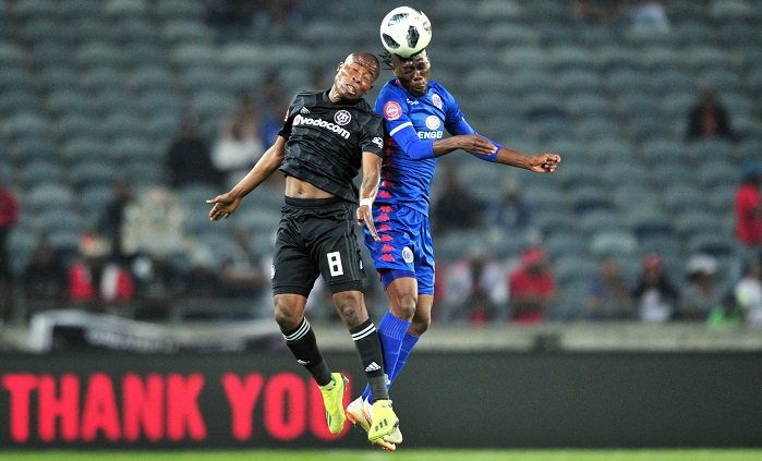 Reneilwe Letsholonyane of Supersport United challenged by Thabo Matlaba of Orlando Pirates