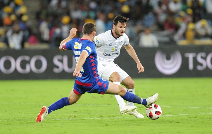 Dean Furman, of Supersport United challenges Roland Putsche of Cape Town City FC