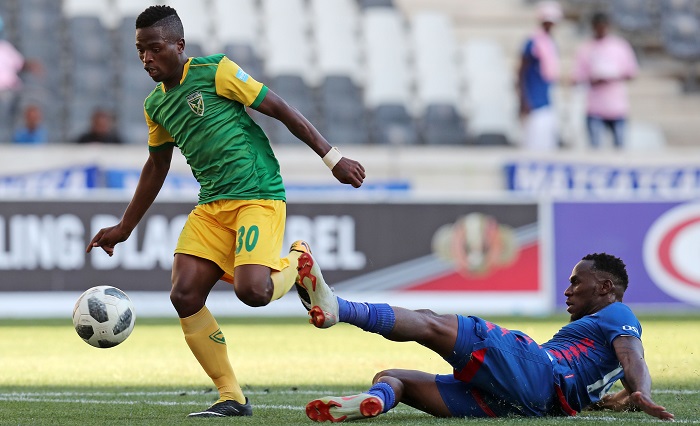 Siboniso Conco of Golden Arrows tackled by Onismor Bhasera of Supersport United