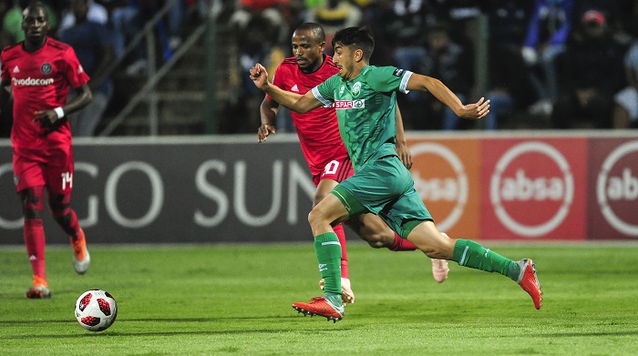 Xola Mlambo of Orlando Pirates challenges Emiliano Tade of AmaZulu