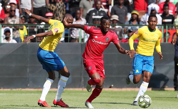 Justin Shonga of Orlando Pirates challenged by Tebogo Langerman of Mamelodi Sundowns