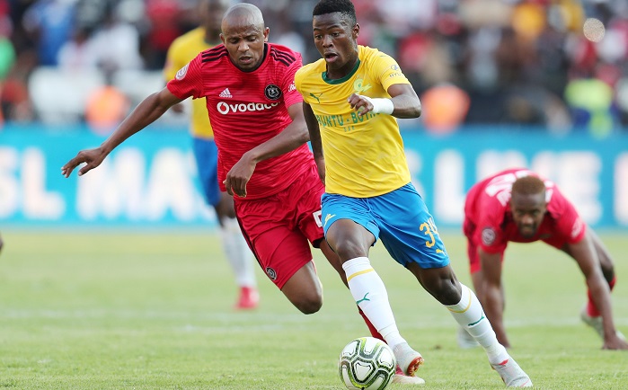 Phakamani Mahlambi of Mamelodi Sundowns challenged by Xola Mlambo of Orlando Pirates