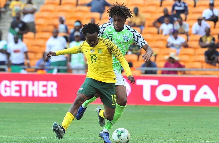 Percy Tau of Bafana Bafana challenged by Alex Iwobi of Nigeria