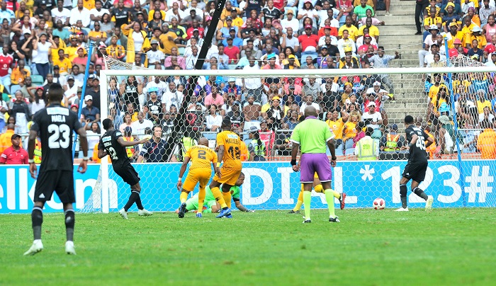 Justin Shonga of Orlando Pirates score a goal passed Itumeleng Khune of Kaizer Chiefs