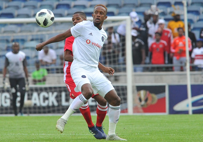 Linda Mntambo of Orlando Pirates challenges Andrew Isaak of African Stars