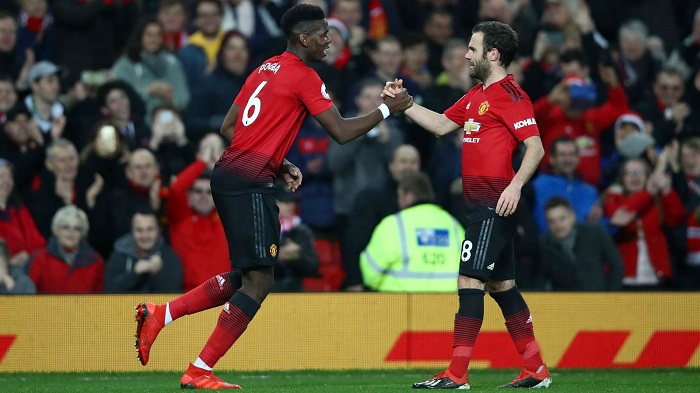 Paul Pogba and Juan Mata of Manchester United