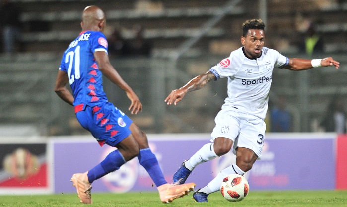 Kermit Erasmus of Cape Town City challenged by Phumlani Ntshangase of Supersport United