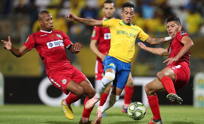 Achraf Dari and Brahim Nakach of Wydad challenges Gaston Sirino of Mamelodi Sundowns