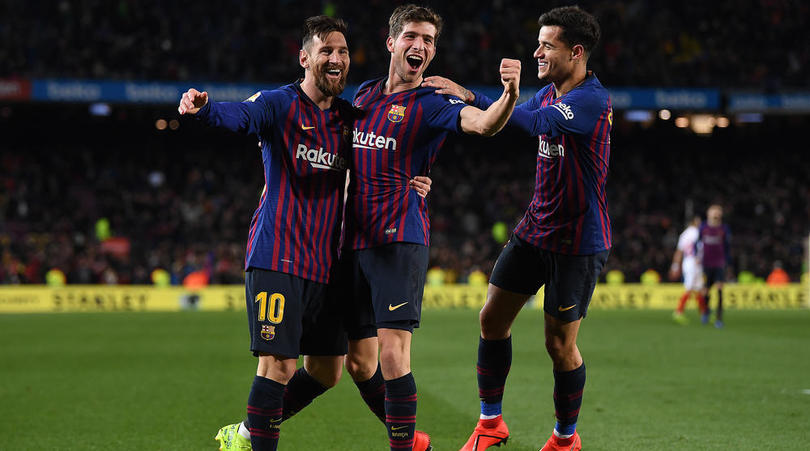 Philippe Coutinho of Barcelona celebrates scoring alongside Sergi Roberto and Lionel Messi