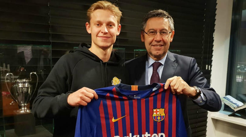 Frenkie De Jong and Barcelona president Josep Bartomeu after signing for the La Liga giants