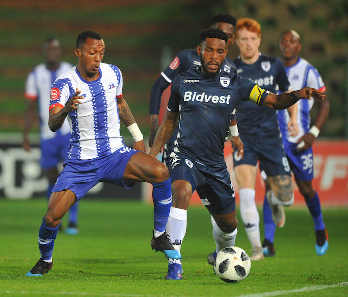 Thulani Hlatshwayo of Bidvest Wits is tackled by Yannick Zakri of Maritzburg United during the Absa Premiership match between Bidvest Wits and Maritzburg United 01 February 2019 at Bidvest Stadium Pic Sydney Mahlangu/ BackpagePix