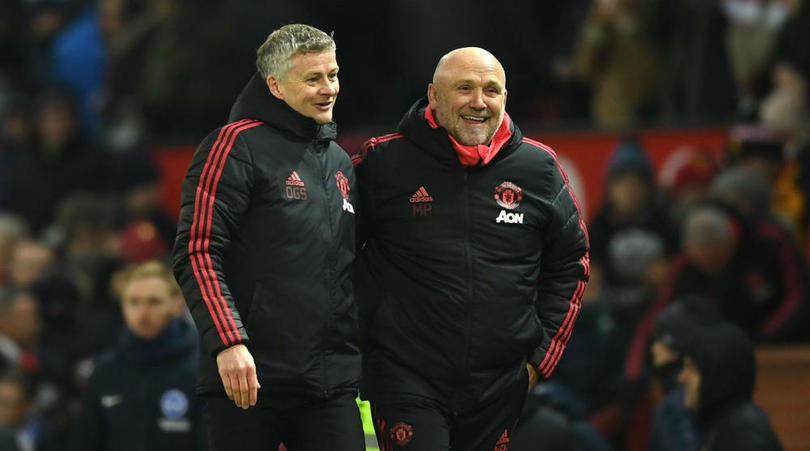 Manchester United's coach Ole Gunnar Solskjaer and assistant manager Mike Phelan