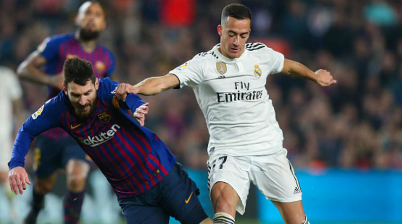 Lucas Vazquez of Real Madrid and Lionel Messi of Barcelona