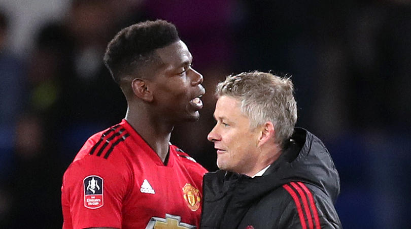 Manchester United Paul Pogba and caretaker manager Ole Gunnar Solskjaer