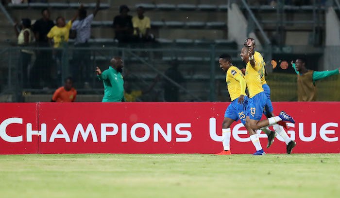 Lebohang Maboe celebrates his goal with Tiyani Mabunda and Anthony Laffor