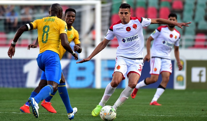 Achraf Dari of Wydad Athletic Club challenged by Hlompho Kekana of Mamelodi Sundowns