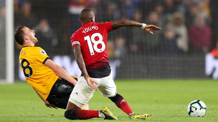 Ashley Young of Manchester United sent off for his challenge on Diogo Jota of Wolves