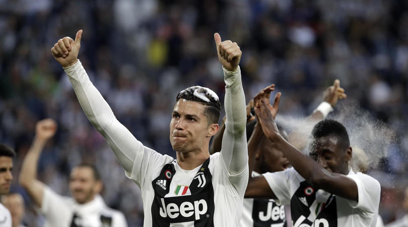 Juventus players celebrate after securing their 8th successive Serie A title (AP Photo/Luca Bruno)