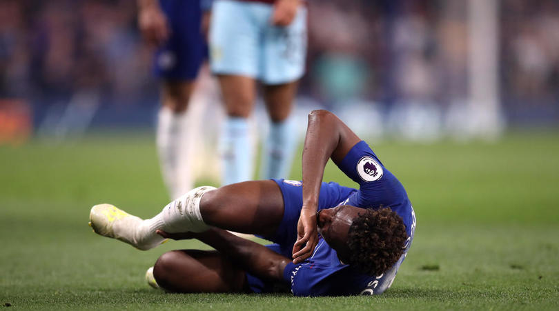 Chelsea's Callum Hudson-Odoi picks up an injury during the Premier League match at Stamford Bridge