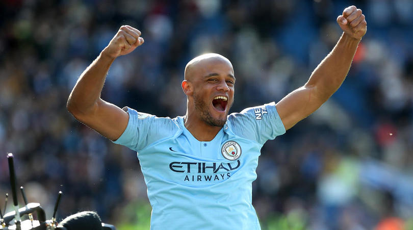 Manchester City's Vincent Kompany celebrates winning the title after the Premier League match at the AMEX Stadium, Brighton.