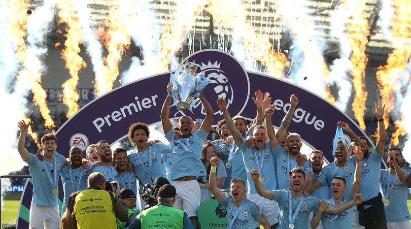 Manchester City lift the Premier League trophy after the Premier League match at the AMEX Stadium, Brighton.