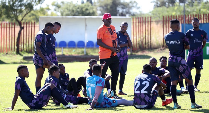 Dan Malesela, coach of TS Galaxy talking to his player after training