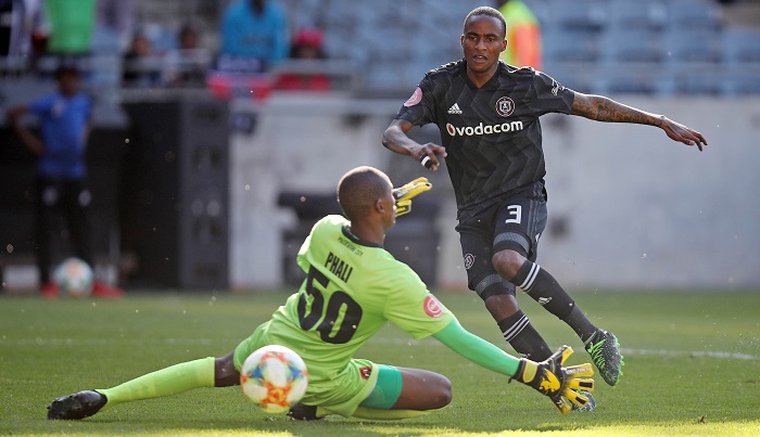 Thembinkosi Lorch of Orlando Pirates scores a goal against Lehlohonolo Phali of Polokwane City