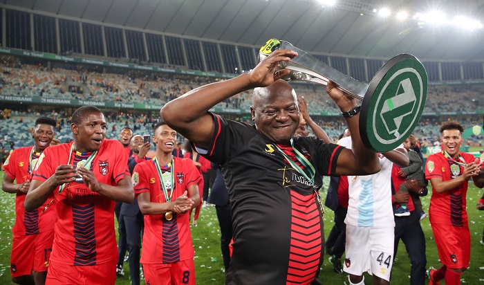 Daniel Malesela, coach of TS Galaxy celebrates with the Nedbank Cup trophy